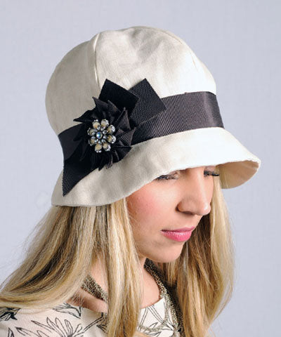 Grace Cloche Style Hat Linen in Seashell Featuring Chocolate Grosgrain Band and Pinwheel Flower Brooch | By Pandemonium Millinery | Seattle WA USA