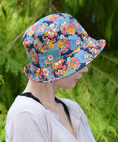 Side view of Hollie Sun Hat in Porcelain Vase. Handmade in America by Pandemonium Seattle.