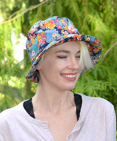 Model wearing Hollie Sun Hat in Porcelain. Vase. Handmade in America by Pandemonium Seattle.
