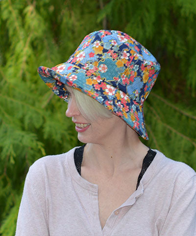 Model features a Hollie Sun Hat in Porcelain. Vase. Handmade in America by Pandemonium Seattle.
