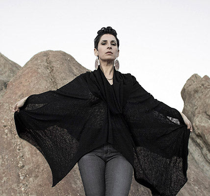 Model is wearing the Badlands Cloak with hood up, in Scorpion. By Leigh Young Collection handmade in Seattle WA