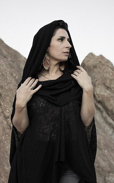 Model is wearing the Badlands Cloak with hood up, in Scorpion. By Leigh Young Collection handmade in Seattle WA
