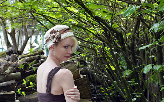 Lola Hat Linen in Seashell with Brown Flower Brooch Model Shot Handmade by Pandemonium Seattle