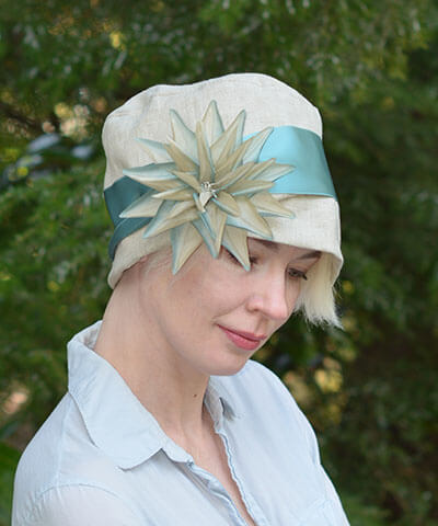 Flower Trim Starburst in Green and Beige on Linen Hat | Pandemonium Millinery