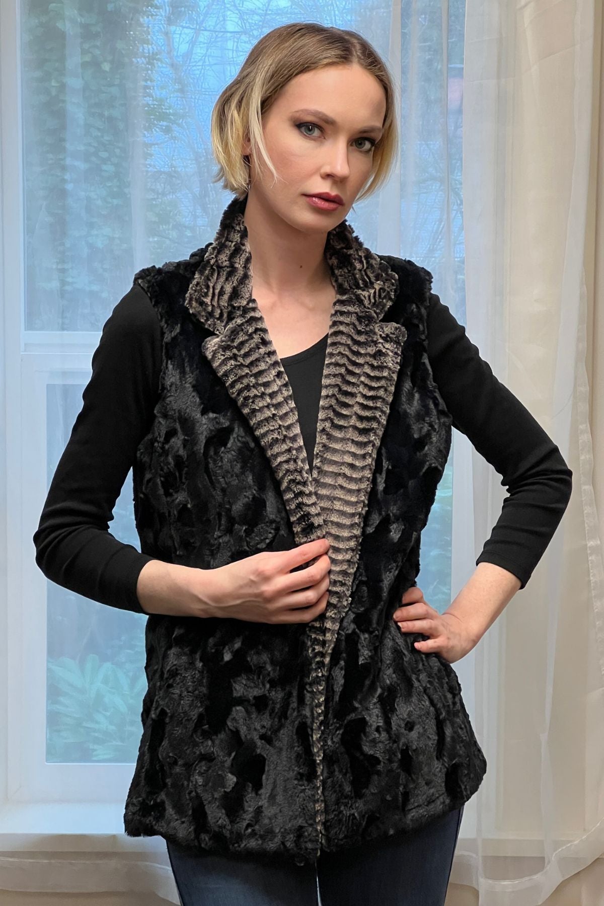 Woman wearing a reversed Mandarin Vest Short style in 8mm Sepia color with Cuddly Black Faux Fur. Reversible. Made in Seattle, WA, USA by Pandemonium Seattle.