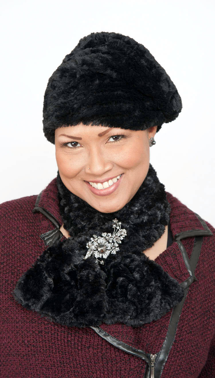 woman wearing solid black pull through scarf with rhinestone brooch and matching pillbox