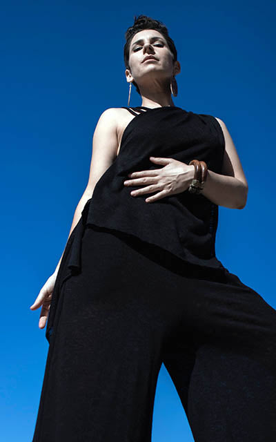 Woman modeling LYC Gaucho Pants and Moab Top both in Scorpion. Leigh Young Collection