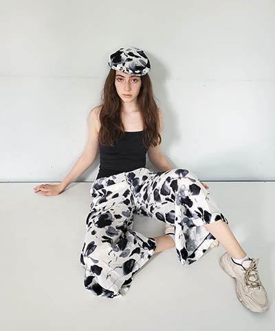 Model wearing Gaucho Pants in Linen Black and White Floral. Leigh Young Collection