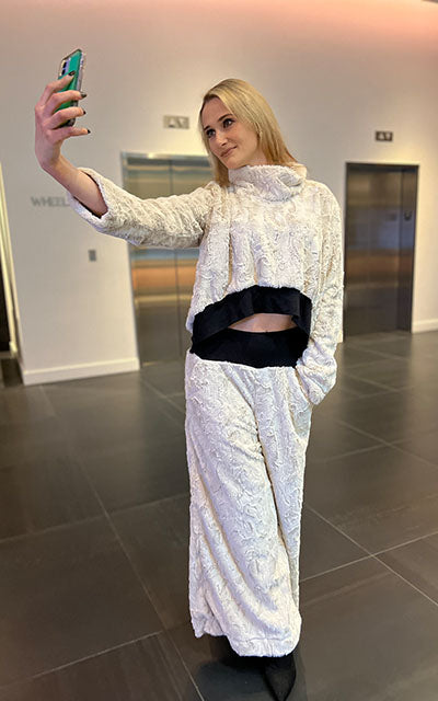Woman wearing the NW Set in matching Cuddly Sand Faux Fur. Made by Pandemonium Seattle.