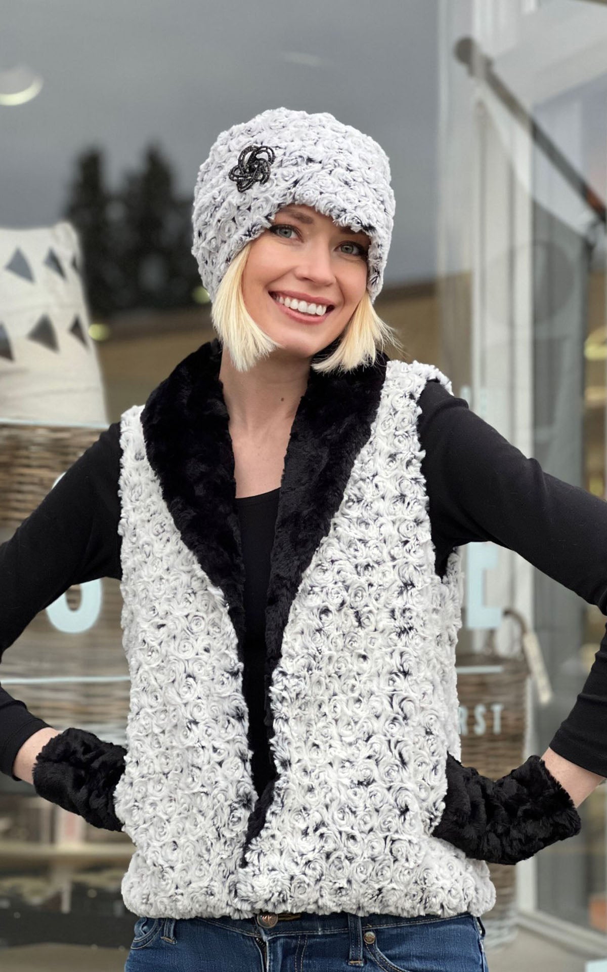 Model with hands on hip wearing Shawl Collar Vest  and matching Cuffed Pillbox| Rosebud in Black Faux Fur with Cuddly Black | By Pandemonium Millinery | Seattle WA USA