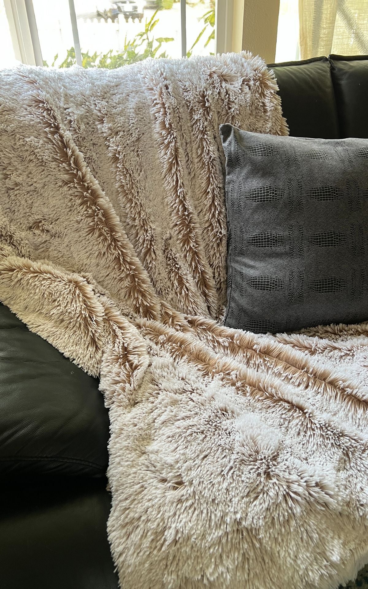 Throw in Foxy Beach faux fur with throw pillow in Outback Brown. Made in Seattle, WA, USA.