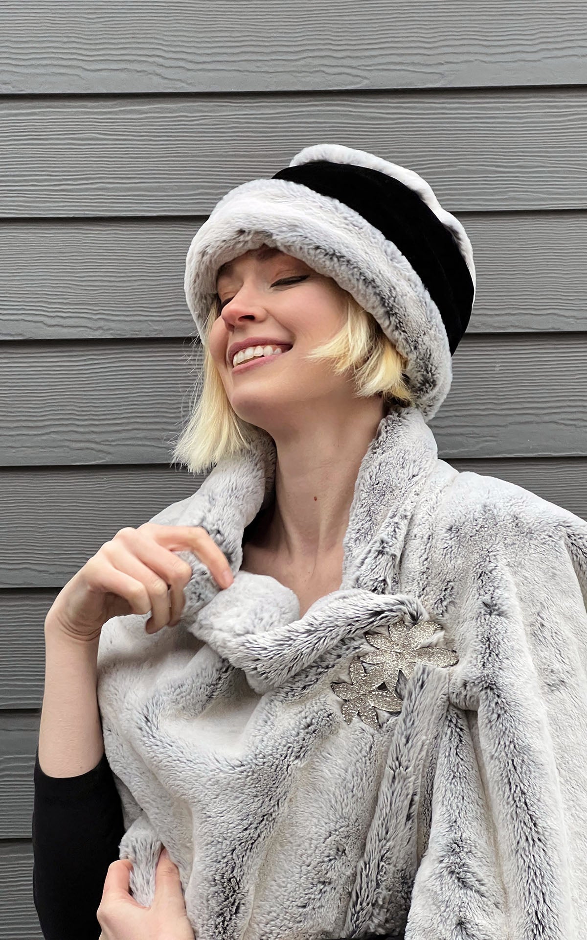 Woman wearing Frosted Cedar Faux Fur Stole with the Rhinestone Double Flower Brooch. Pandemonium Seattle.