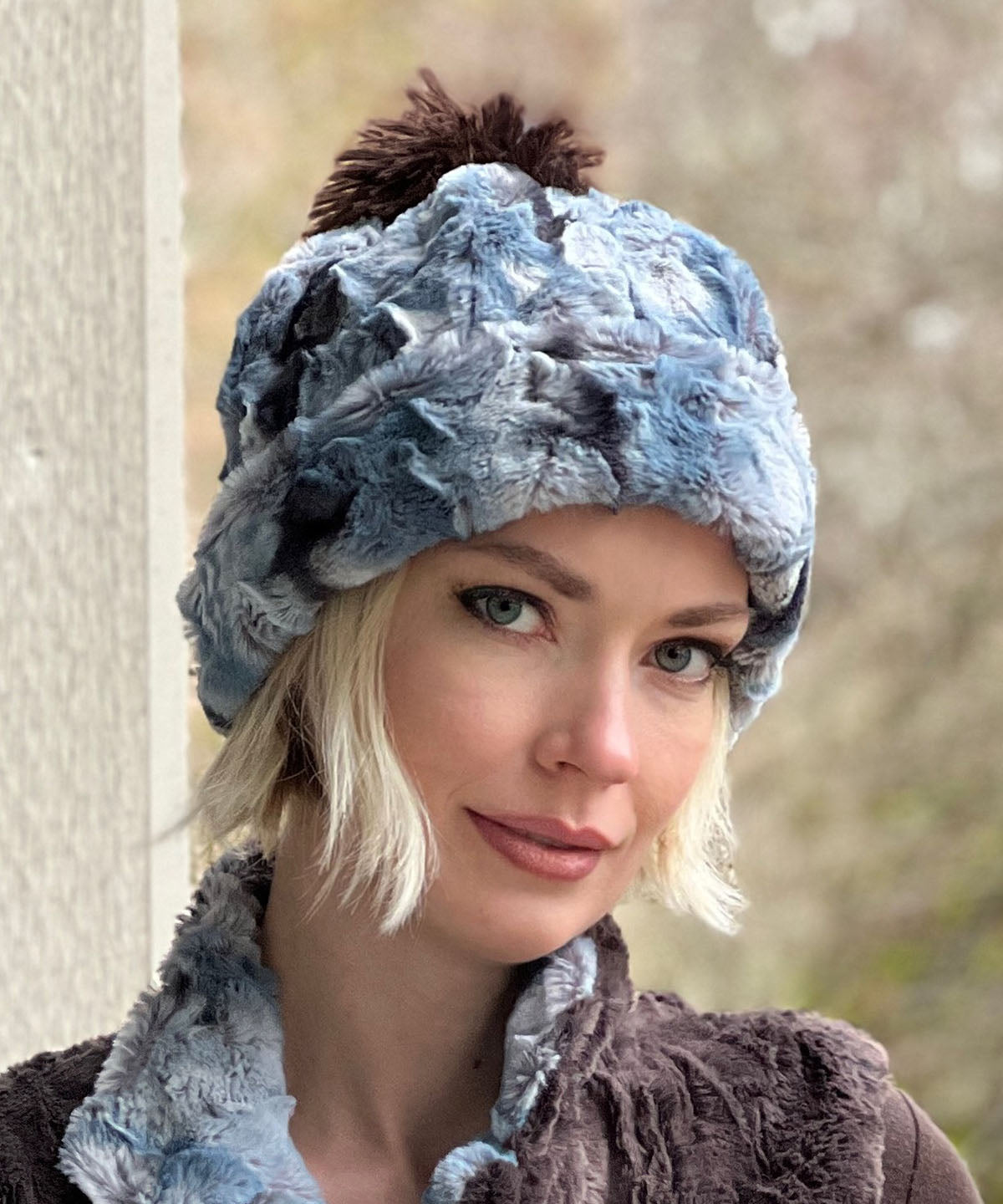  Women&#39;s Reversible Beanie with Pom Pom on model | Cascade in Rainer Sky, Blue, Cream and Brown Faux Fur with Espresso | Handmade USA by Pandemonium Seattle