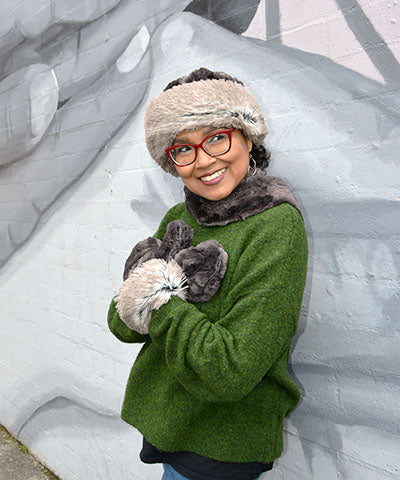 Beanie Hat on Model reversible in Espresso Bean and Arctic Fox Faux Fur Pom Pom. Handmade by Pandemonium Millinery in Seattle, WA