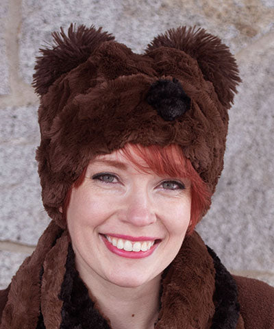 Woman modeling Bear Beanie Hat with ears and nose, in Cuddly Chocolate Faux Fur lined with Black. Handmade by Pandemonium Millinery.
