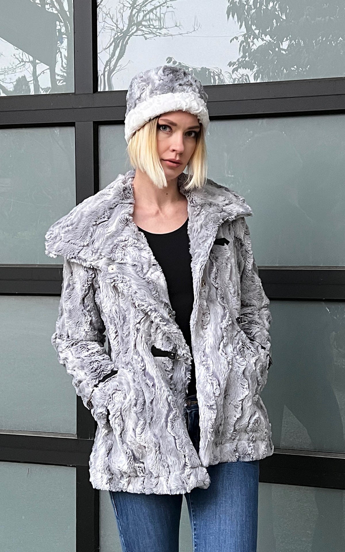 Model shown in  an open Dietrich Coat and matching Cuffed Pillbox | Winter River  bluish Gray with a hint of periwinkle Faux Fur Pea Coat | Featuring Buckle Clasps | Handmade in Seattle, WA | Pandemonium Millinery