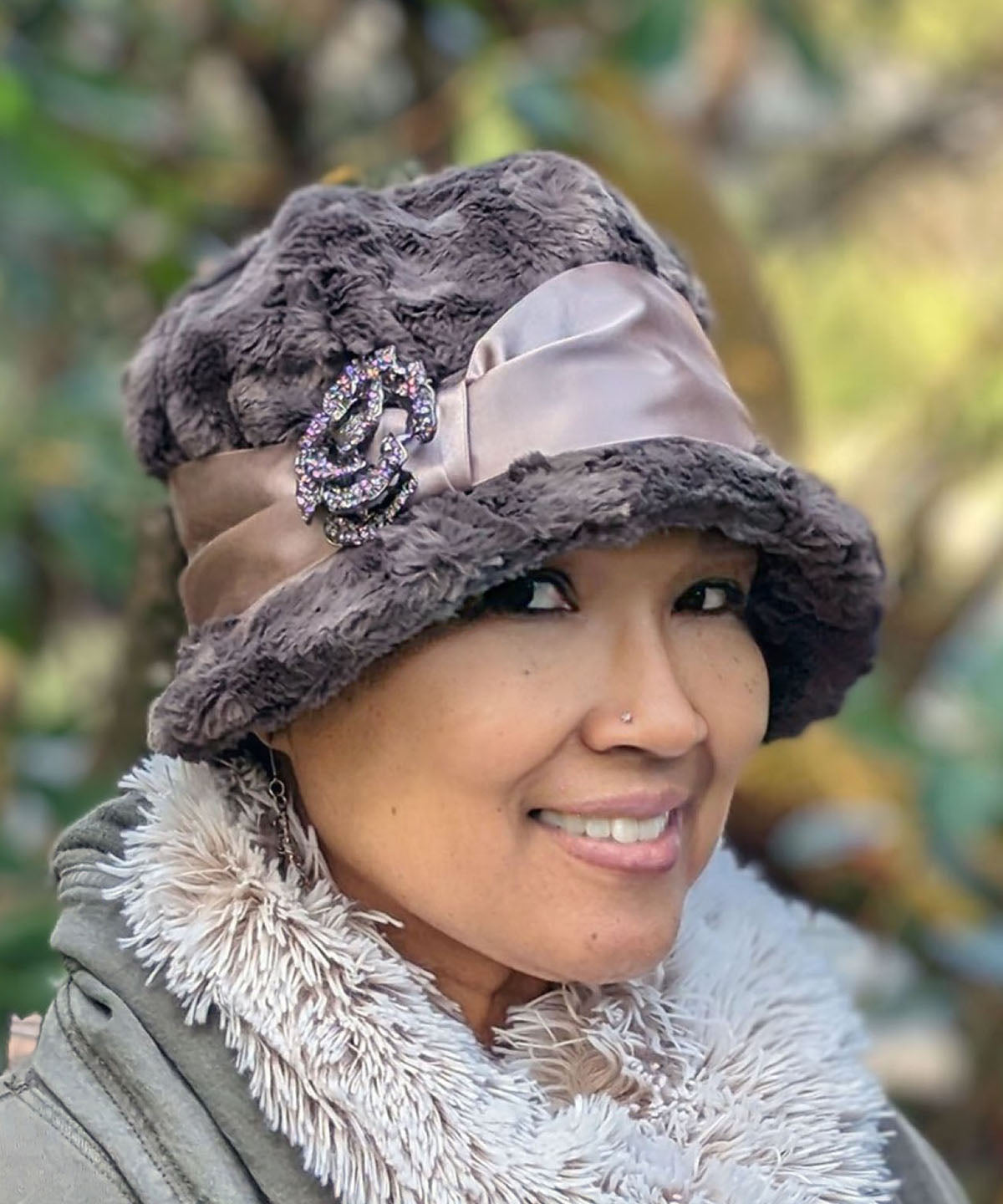  Close up of Woman wearing Grace Cloche Hat in Gray Cuddly Faux Fur with Champagne Satin Sash and Rhinestone Flower Feather Brooch | Handmade in Seattle WA | Pandemonium Millinery
