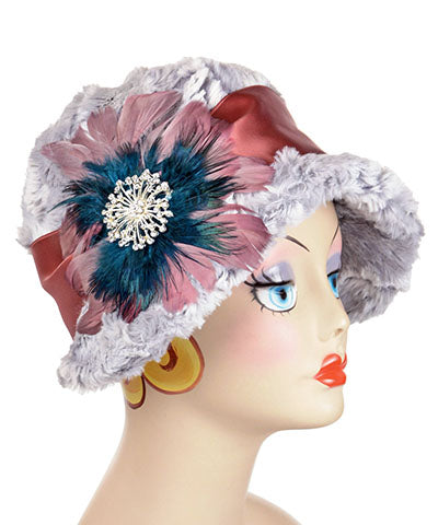 Grace Cloche hat shown in Luxury Faux Fur in Winter River with  Rouge pink satin sash with Feather medallion Pink and Teal Brooch by Pandemonium Seattle. Handmade in Seattle WA USA.