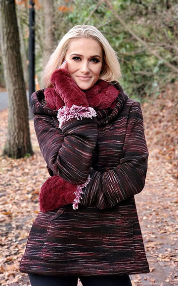 Woman wearing plush, knit Hooded Lounger in Cherry Cordial Sweet Stripes. Also wearing Cranberry Creek Neckwarmer and Fingerless Gloves. Made in Seattle, WA, USA.
