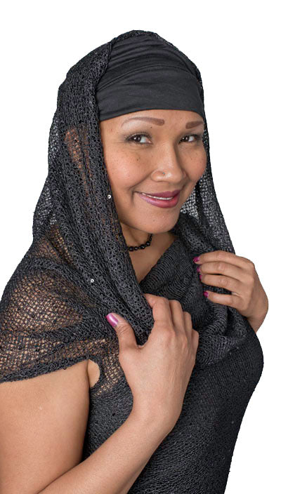 Model wearing the Hooded Cowl Top a This top can be worn as a cowl neck, off-shoulder, or hooded style. | Glitzy Glam in Black, an open weave knit with delicate sequins throughout | Handmade in Seattle WA | Pandemonium Millinery