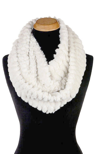Product shot of Women’s Infinity Scarf | Falkor an off-white Faux Fur with texture of embossed dragon scales | Handmade in Seattle WA | Pandemonium Millinery