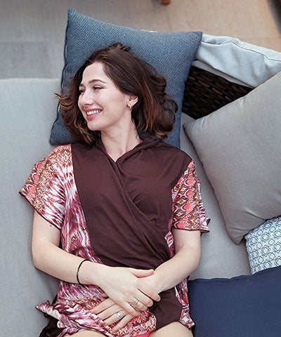 Woman modeling on lounger wearing Kaftan in Pink Dream and Terra