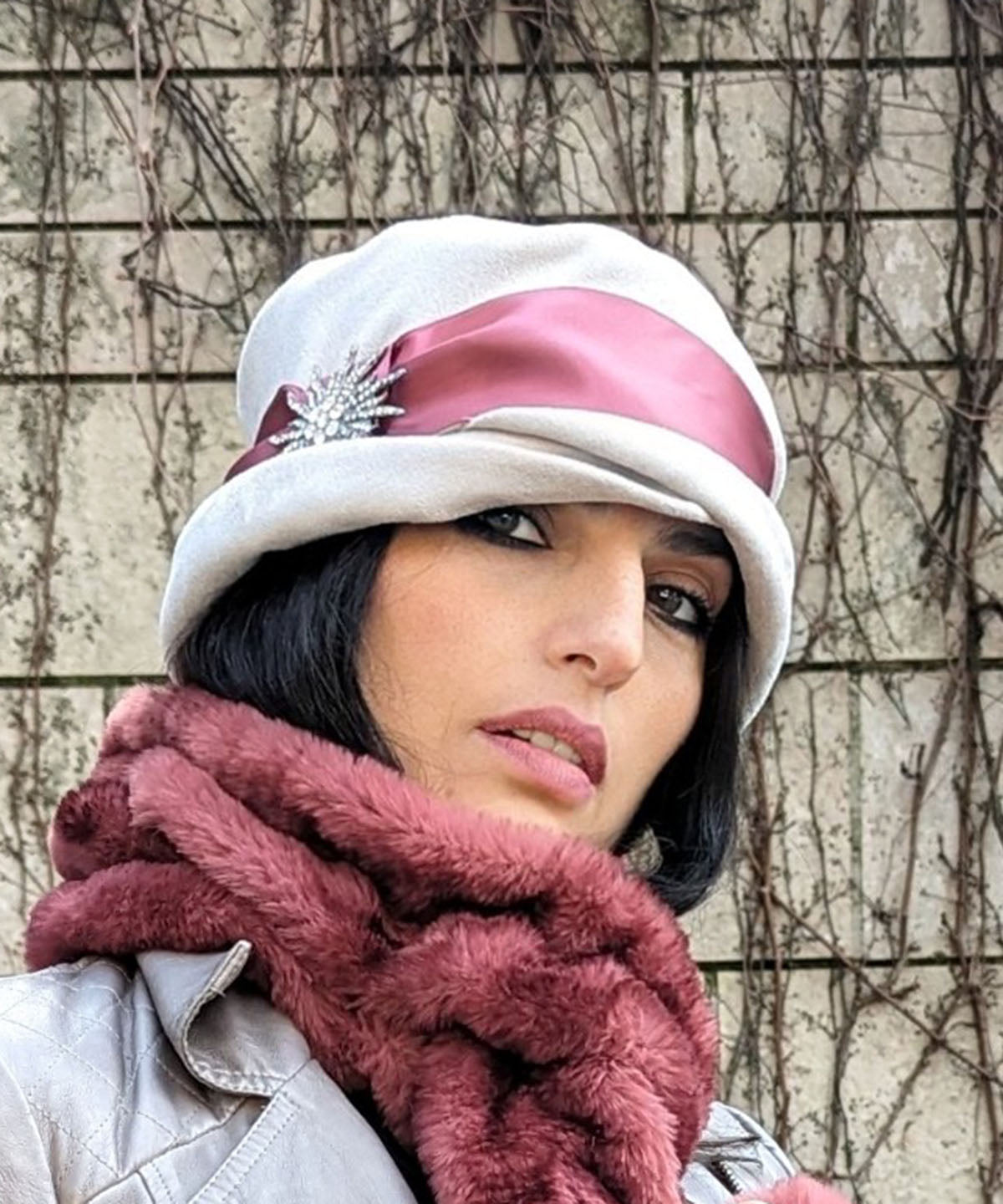 Woman wearing Lola Hat in Silver Faux Suede with Rouge Pink Satin Band and Sunburst Rhinestone Brooch Handmade by Pandemonium Seattle