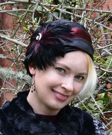 Lola Cloche Style Hat in Outback in Black Vegan Leather with Large Burgundy Feather Handmade by Pandemonium Seattle