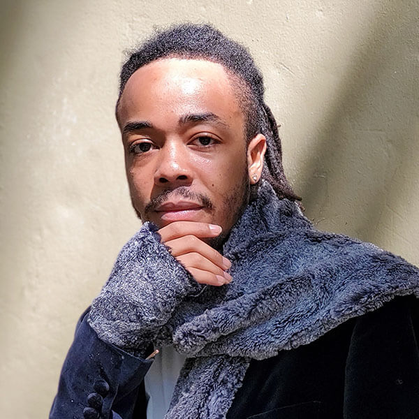 Model is wearing Men's Fingerless Texting gloves in Luxury Faux Fur in Nimbus Handmade in Seattle, WA