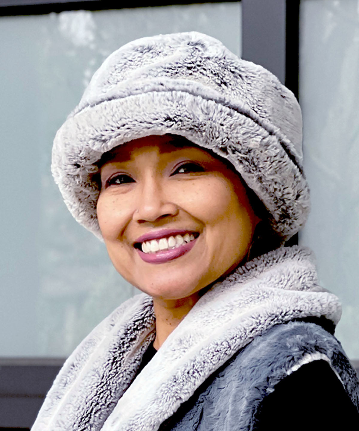 Left side view of Model wearing Molly Bucket Style hat in Frosted Juniper by Pandemonium Seattle.  Handmade in Seattle, WA  USA.