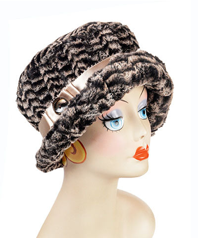 Woman in a Café wearing  Molly Bucket Style Hat in 8mm in  Sepia Faux Fur with Pico Satin Band featuring a Carmel Lucite Button |Handmade By Pandemonium Millinery | Seattle WA USA