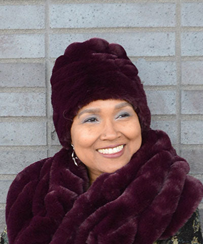 Woman in profile, wearing the Merlot (burgundy) Beanie Hat. Also wearing the Merlot (Burgundy) Shoulder Wrap as a Big Scarf. from Royal Opulence Collection. Made In Seattle.