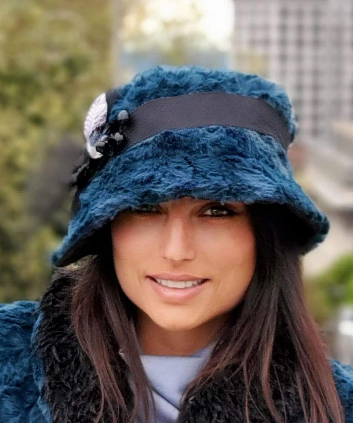 Woman wearing Abigail Hat in Blue Peacock Pond Luxury Faux Fur with Black Faux Suede under brim. Trimmed with Black Grosgrain Band| Handmade in Seattle WA| Pandemonium Millinery 