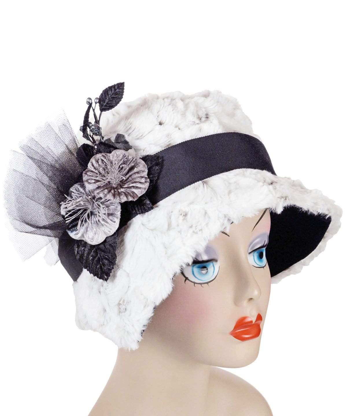 Abigail Hat in Winter’s Frost White Luxury Faux Fur with Black Faux Suede under rim. Trimmed with Black Grosgrain Band and Velvet Silver Flowers| Handmade in Seattle WA| Pandemonium Millinery 