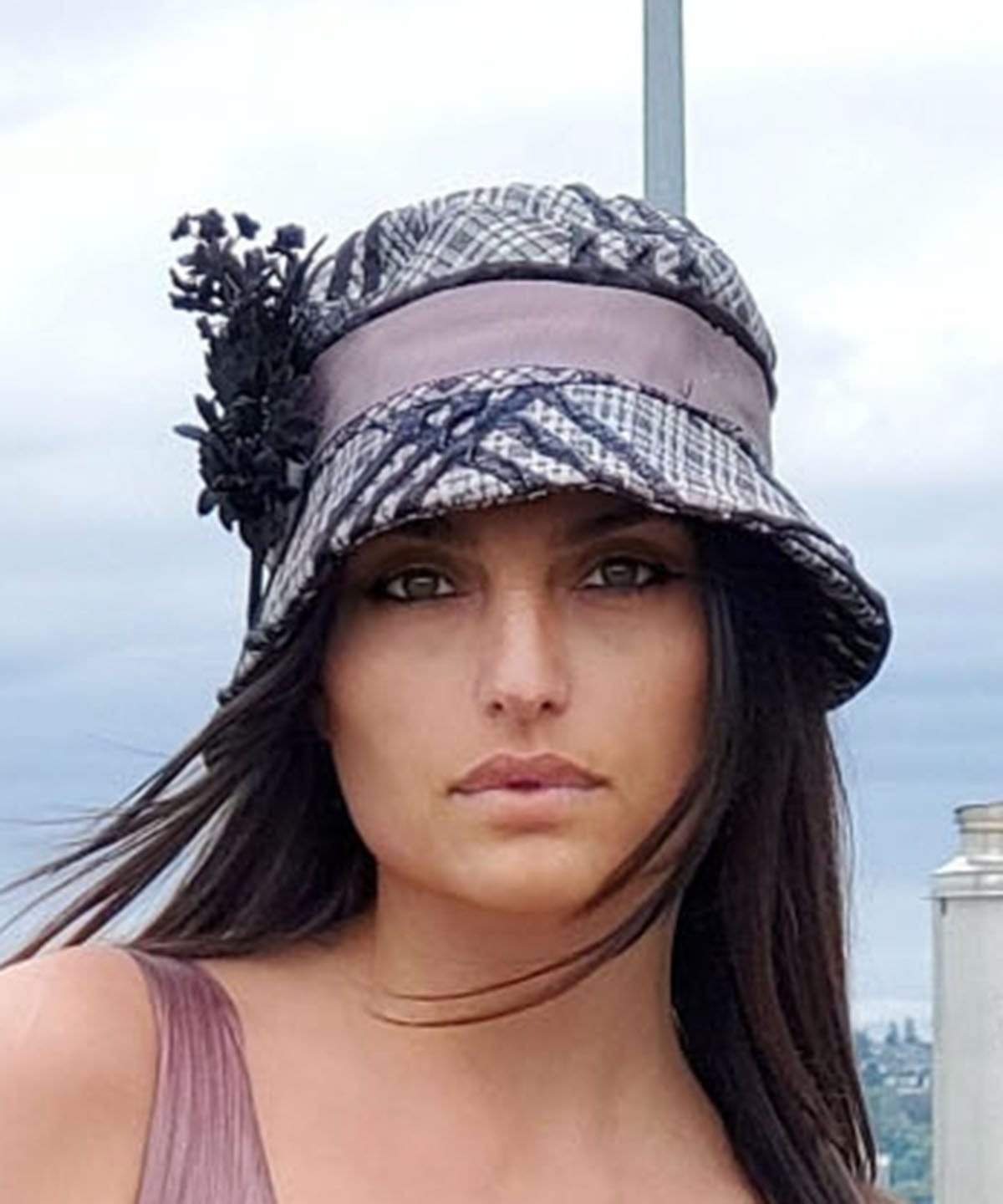 Woman wearing Abigail Hat with brim turned up, in Silver Plaid with Black Velvet Band, Feather and Button | Handmade in Seattle WA | Pandemonium Millinery 