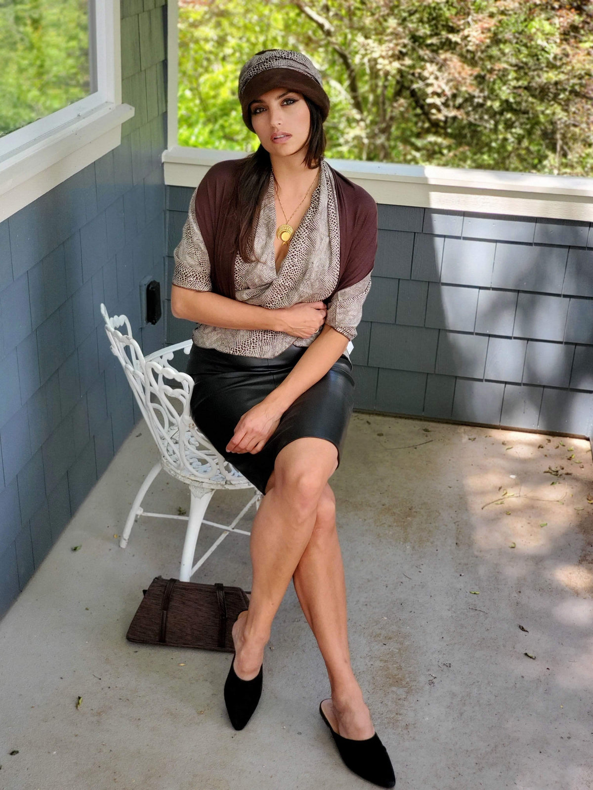 Woman wearing Ana Cloche Hat in Chocolate Faux Suede and Cobra Snake Band. With matching Cobra Top| Handmade in Seattle WA| Pandemonium Millinery