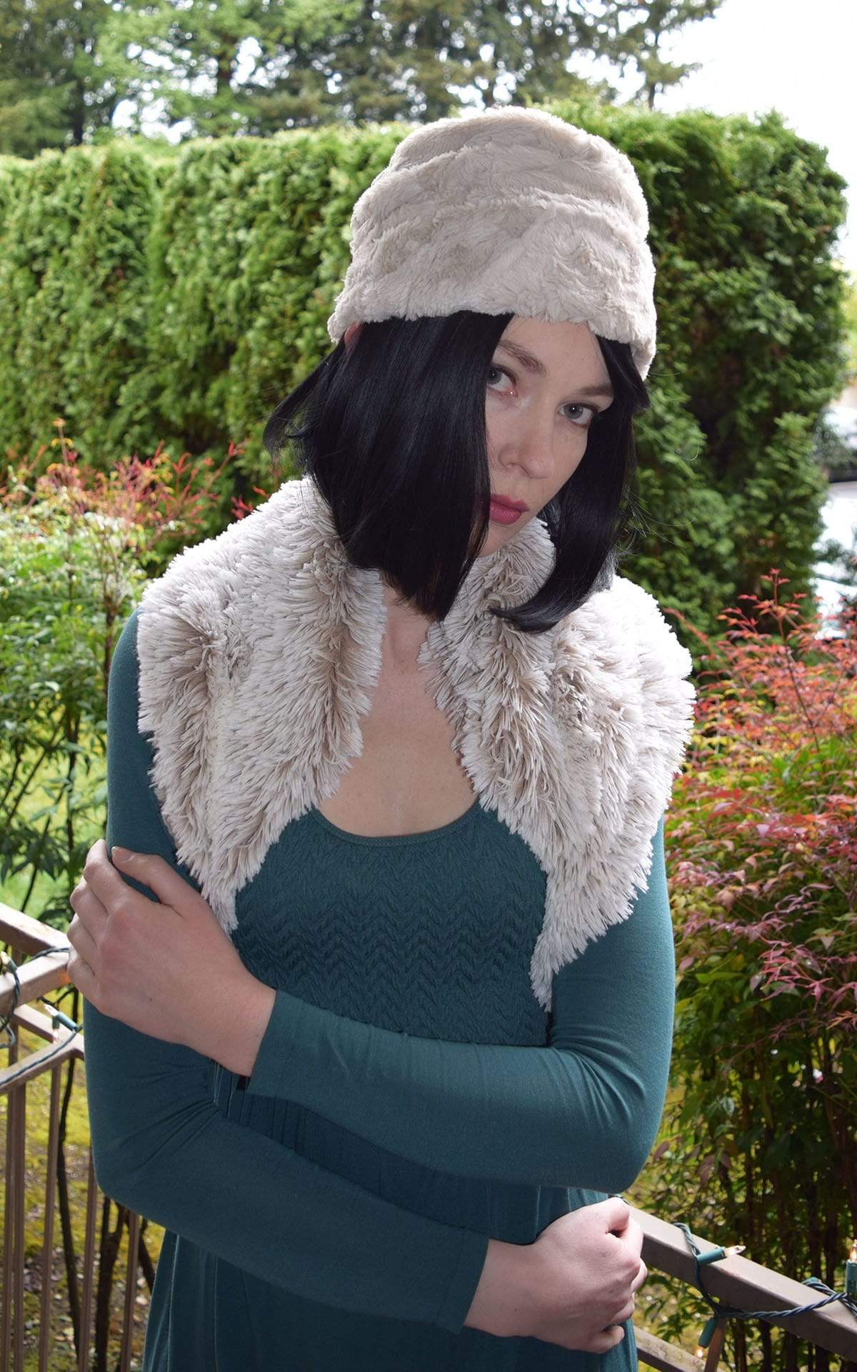 Side view of woman wearing Ana Cloche Hat in Sand Cuddly Faux Fur with no band| Handmade in Seattle WA| Pandemonium Millinery