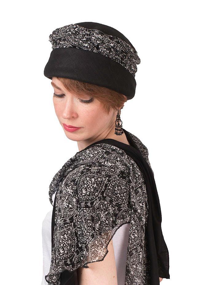 Woman wearing Ana Cloche Hat in Black Linen with Black and White Paisley Band| Handmade in Seattle WA| Pandemonium Millinery
