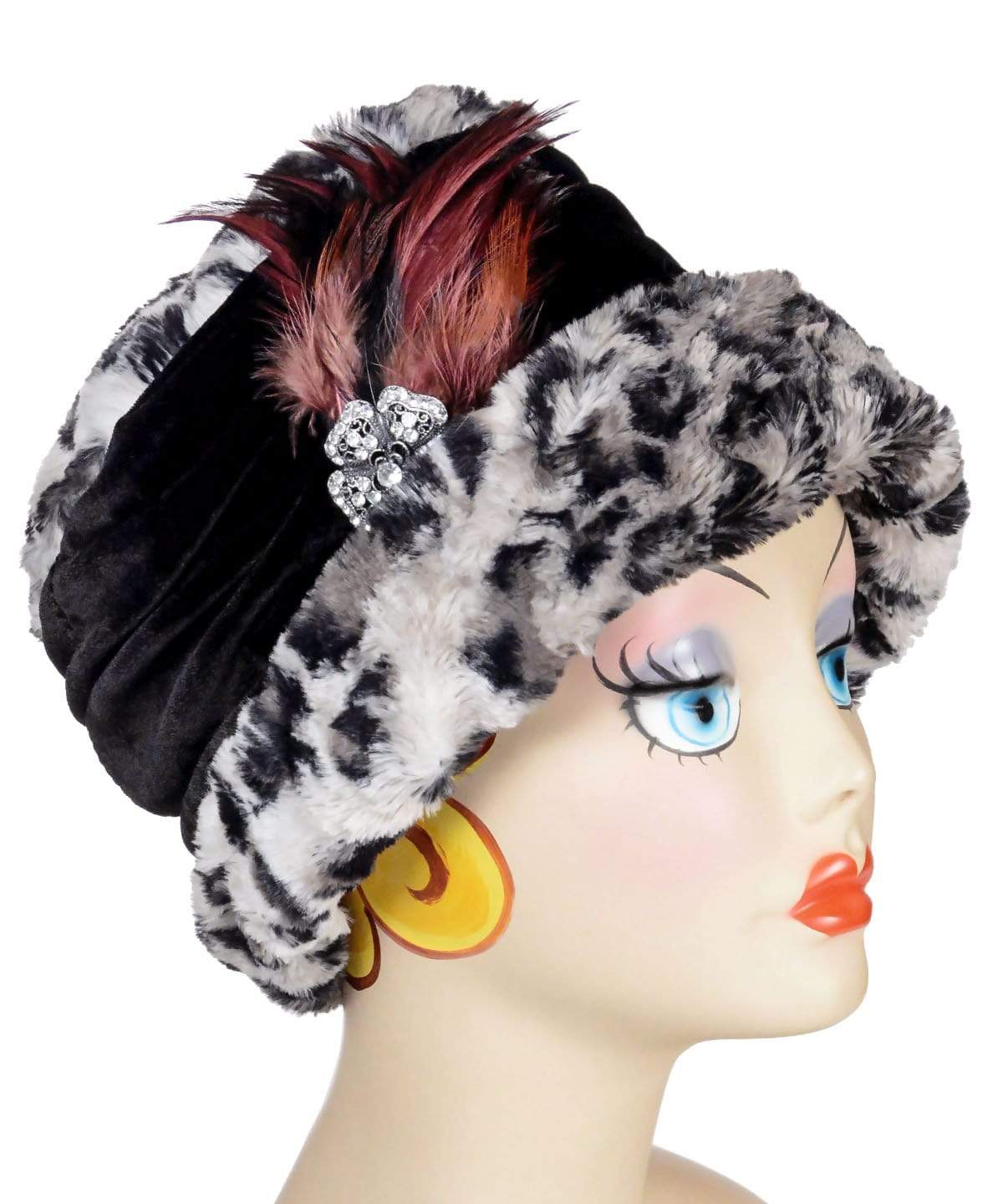 Side view of Ana Cloche Hat in Savannah Cat Luxury Faux Fur with Black Velvet Band | Shown with Black and Red Rhinestone Feather Brooch | Handmade in Seattle WA | Pandemonium Millinery