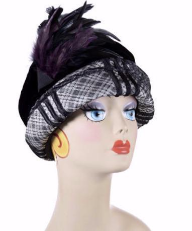 Woman wearing Ana Cloche Hat in Silver Plaid Upholstery Fabric with Black Velvet Band and Feather| Handmade in Seattle WA| Pandemonium Millinery