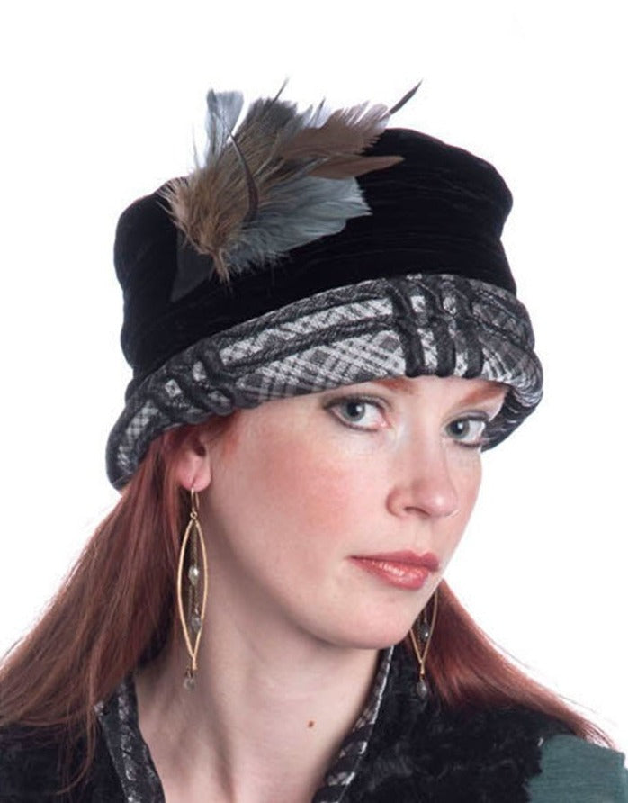 Woman wearing Ana Cloche Hat in Silver Plaid Upholstery Fabric with Black Velvet Band and Feather| Handmade in Seattle WA| Pandemonium Millinery
