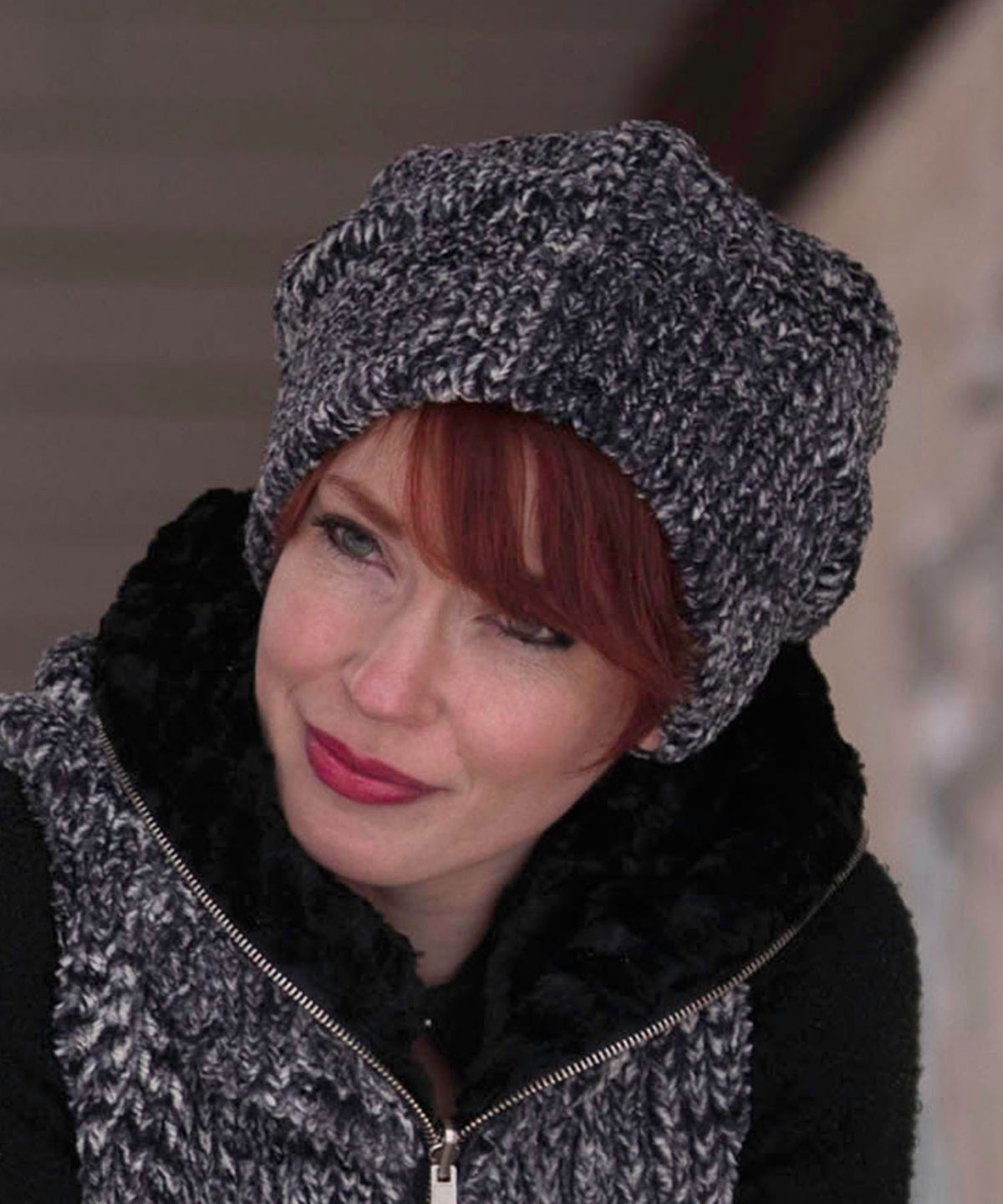 Woman modeling Beanie Hat and jacket in Ash Cozy Cable and Cuddly Faux Fur in Black. Handmade by Pandemonium Millinery in Seattle, WA.