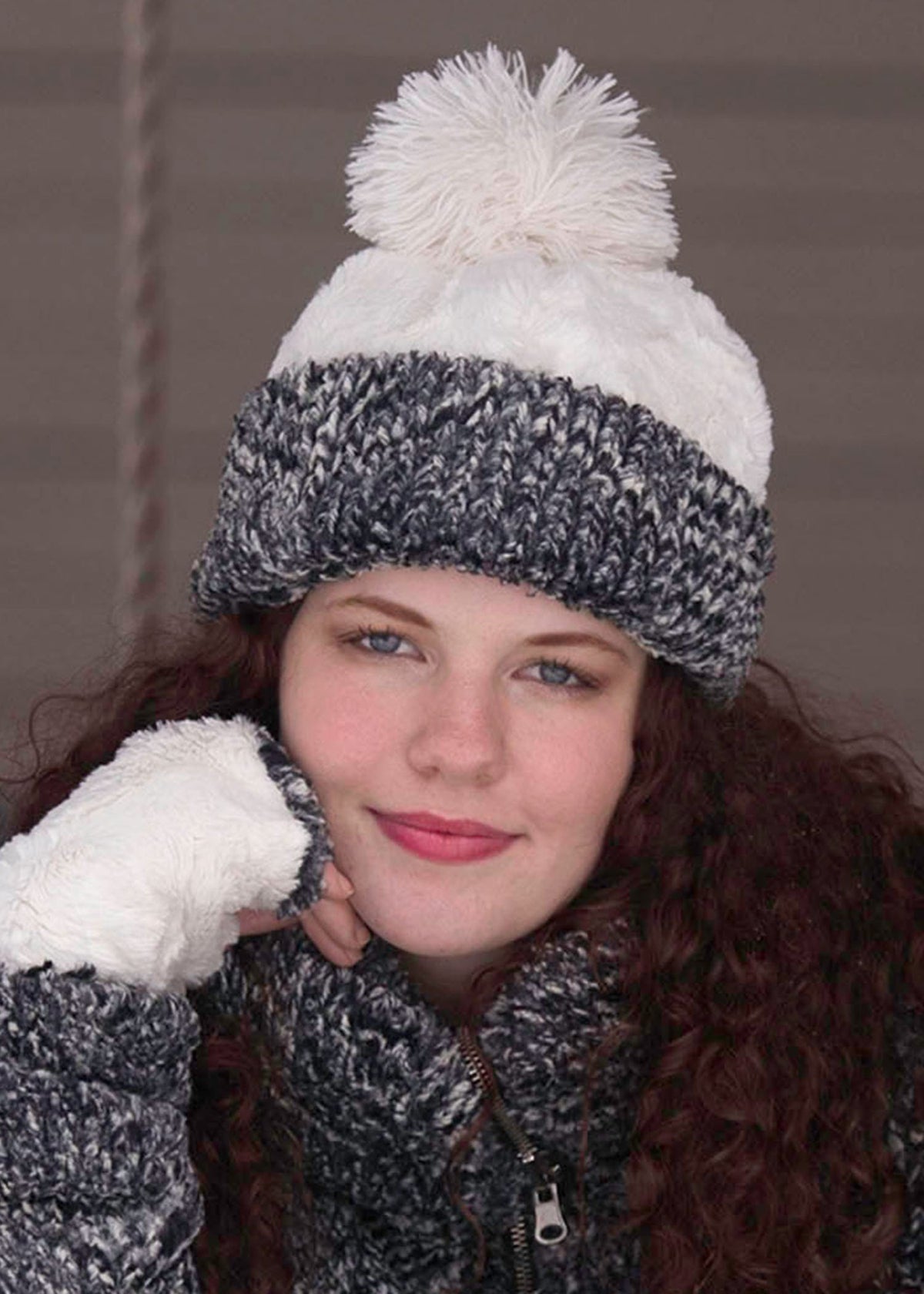 Woman modeling Beanie Hat and jacket in Ash Cozy Cable and Cuddly Faux Fur in Ivory. Handmade by Pandemonium Millinery in Seattle, WA.