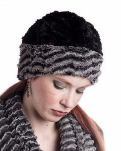 Woman modeling Beanie Hat reversible in Charcoal Desert Sand and Cuddly Black Faux Fur with Pom. Handmade by Pandemonium Millinery in Seattle, WA.