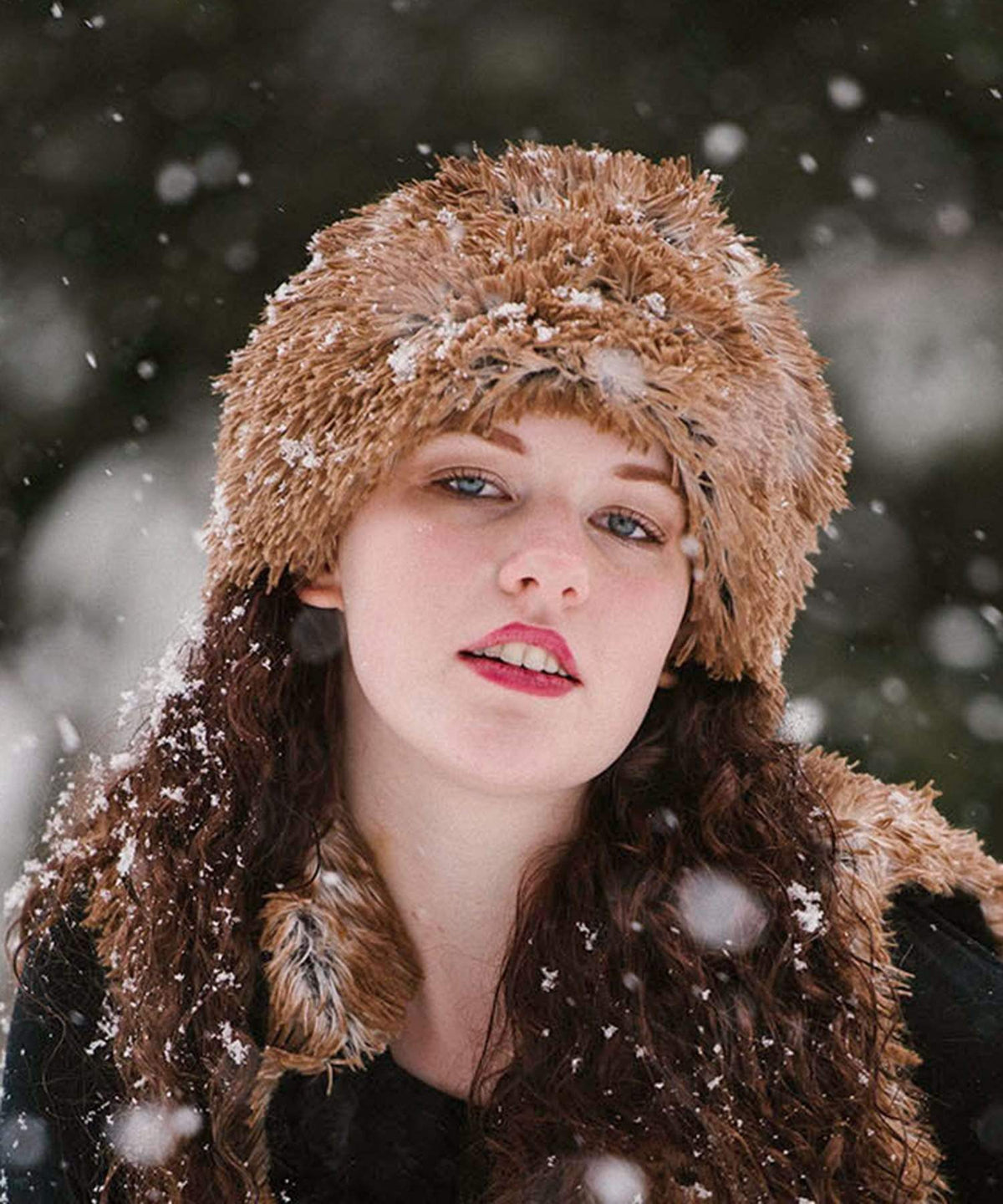 Woman modeling Beanie Hat and Vest reversible in Red Fox and Cuddly Black Faux Fur. Handmade by Pandemonium Millinery in Seattle, WA.