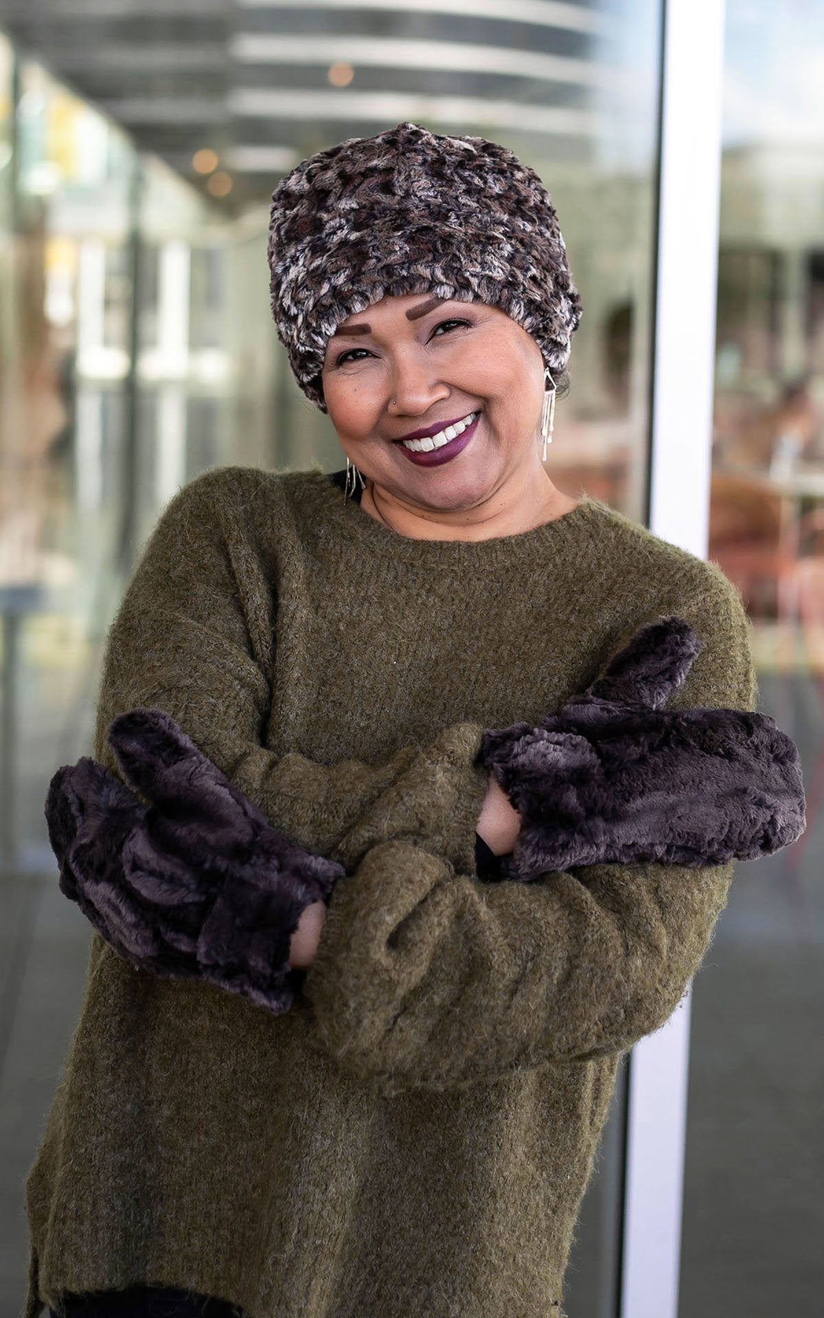 Woman modeling Beanie Hat reversible in Calico and Cuddly Chocolate Faux Fur, shown uncuffed. Handmade by Pandemonium Millinery in Seattle, WA.