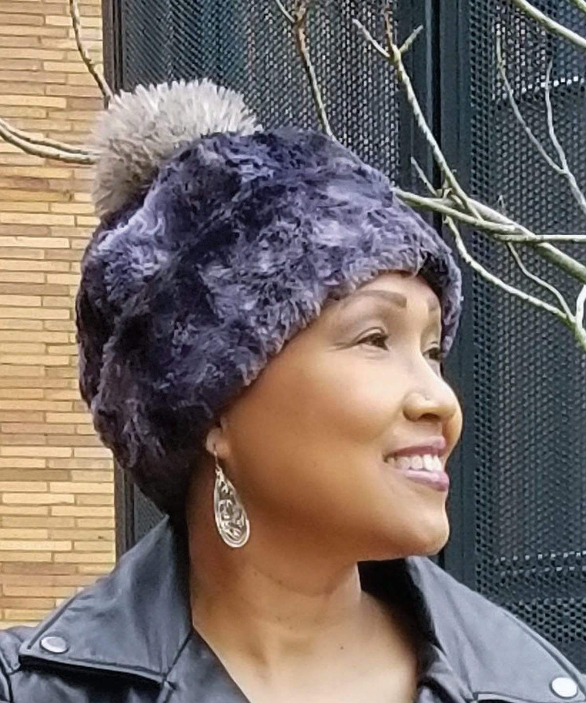Woman modeling Beanie Hat, reversible in Luxury Faux Fur - Highland Skye lined in Cuddly Black Faux Fur. Pandemonium Millinery in Seattle, WA.