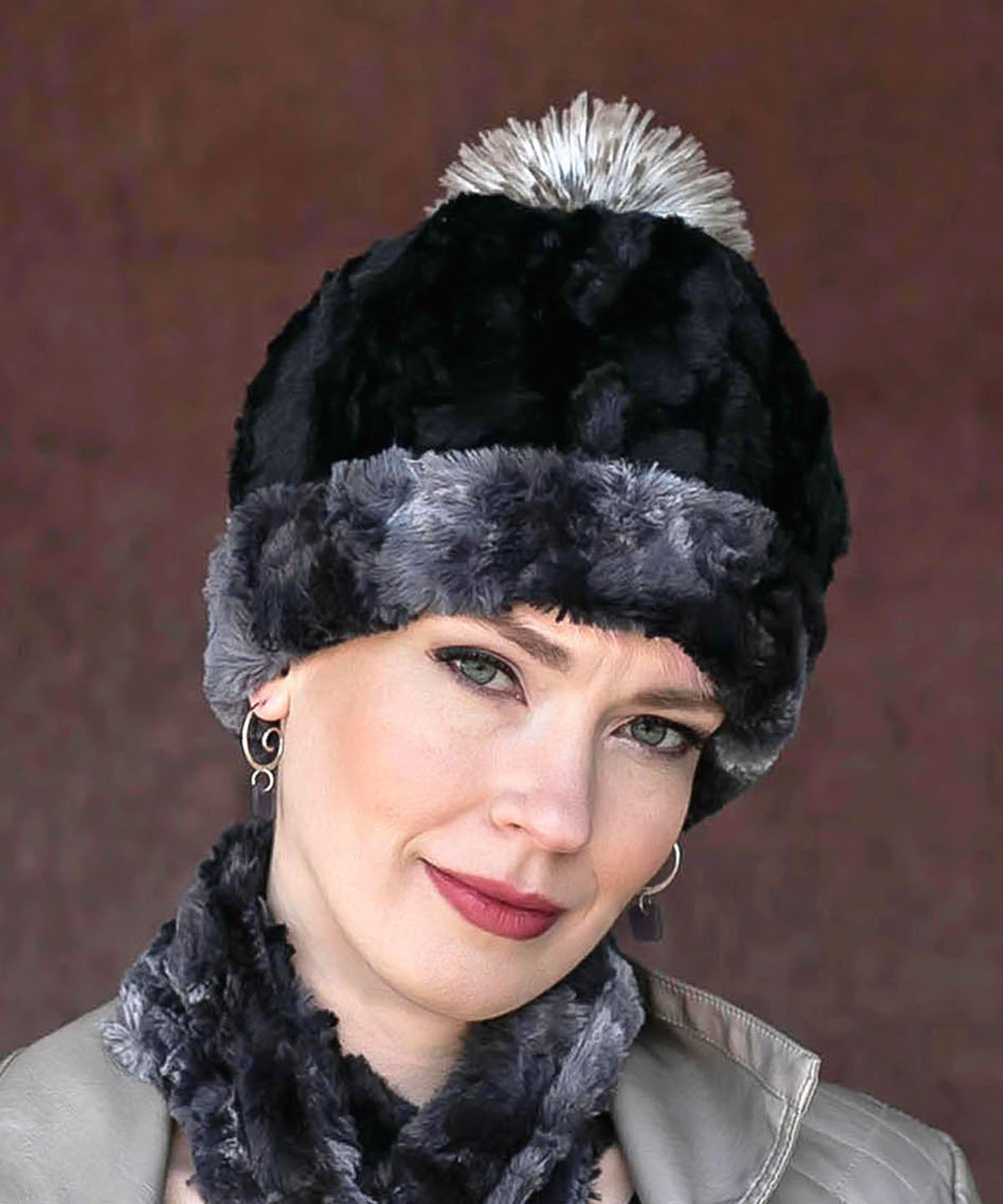 Woman modeling Beanie Hat, shown reversed in Luxury Faux Fur - Highland Skye lined in Cuddly Black Faux Fur. Pandemonium Millinery in Seattle, WA.