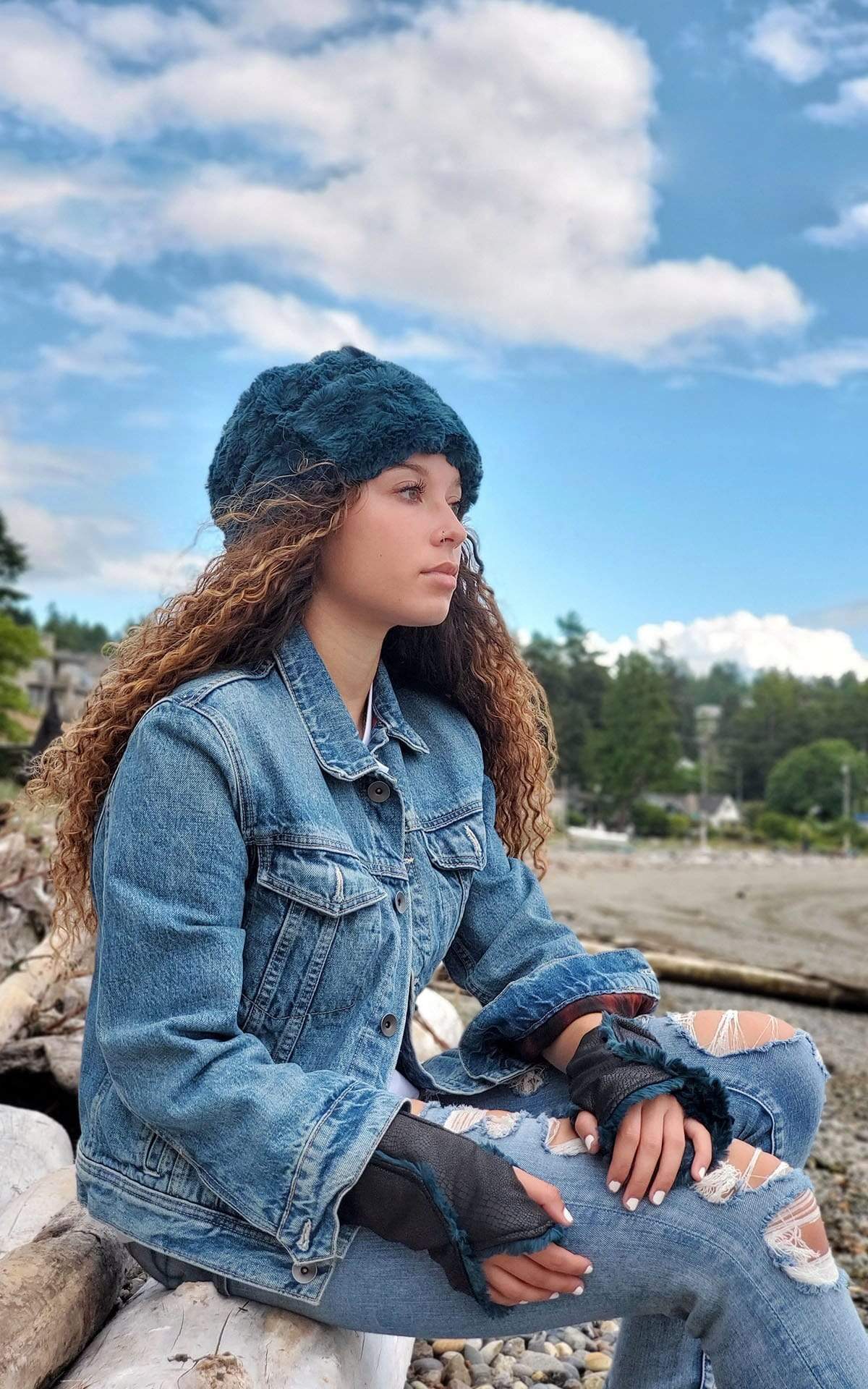 Woman modeling Beanie Hat, reversible - Luxury Faux Fur in Peacock Pond lined in Cuddly Black, side view. By Pandemonium Millinery