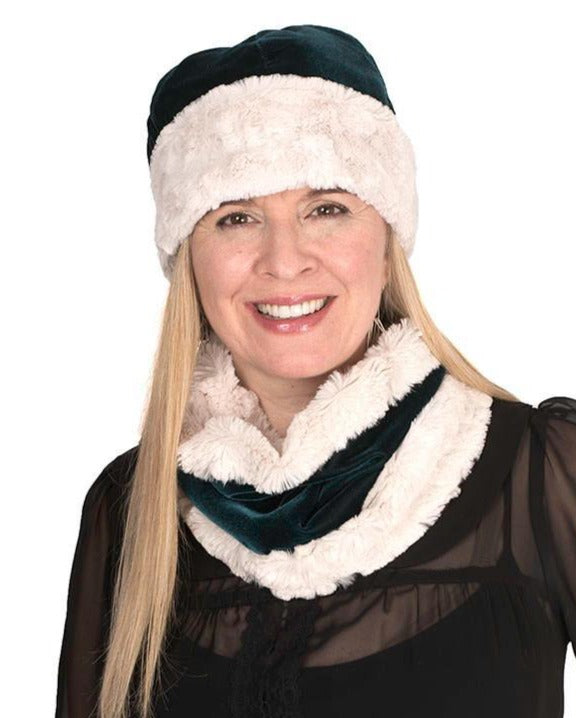 Woman modeling reversible Beanie Hat in Emerald Velvet with Cuddly Sand Faux Fur, with matching scarf. Handmade by Pandemonium Millinery.